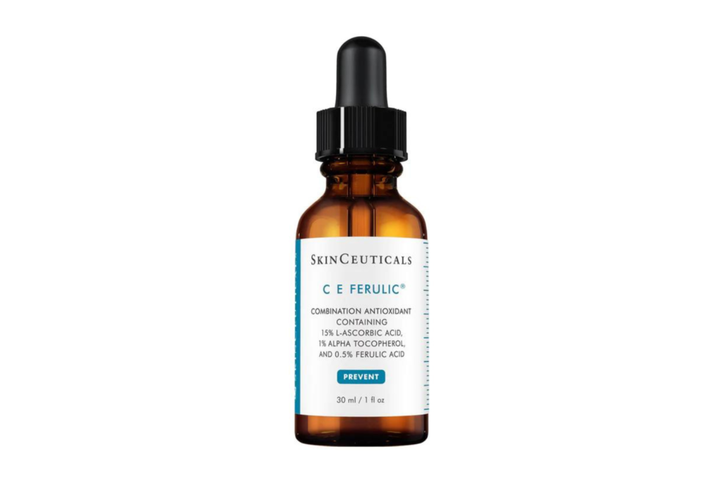 A bottle of SkinCeuticals C E Ferulic serum, known for its powerful antioxidant properties and environmental protection, positioned with other skincare items.